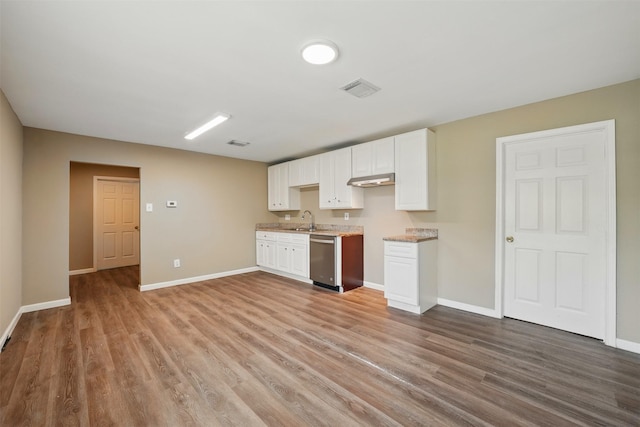 3615 Seabrook St, Houston, TX 77021 - kitchen featuring dishwasher, wood finished floors, a sink, and baseboards