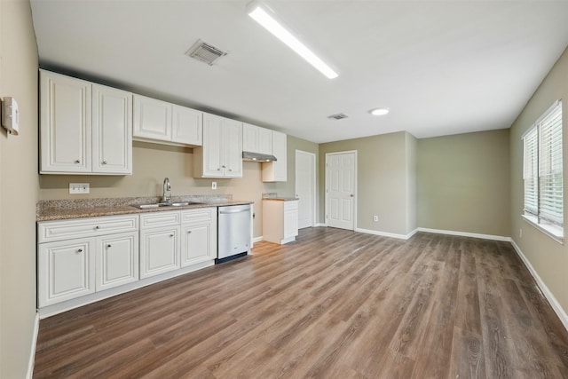 3615 Seabrook St, Houston, TX 77021 - kitchen featuring dishwasher, a sink, light wood-style floors, and white cabinetry