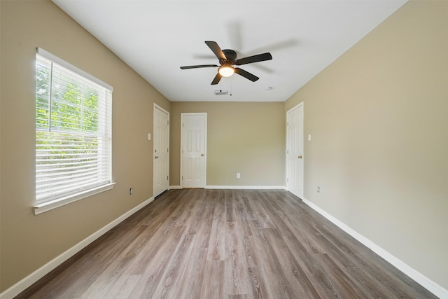 3615 Seabrook St, Houston, TX 77021 - empty room with wood finished floors, a ceiling fan, and baseboards