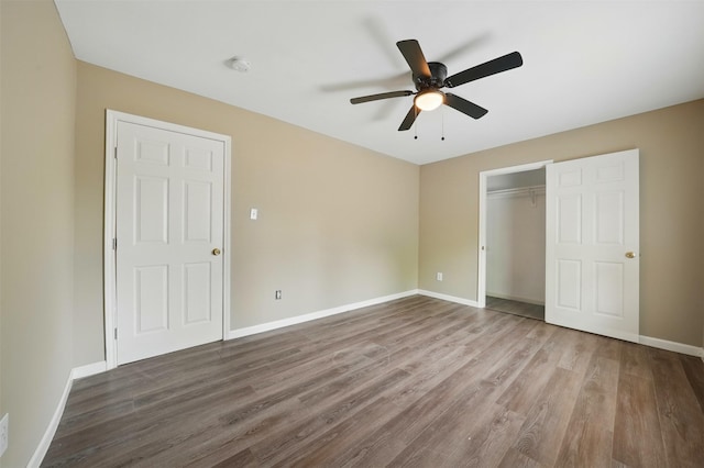 3615 Seabrook St, Houston, TX 77021 - unfurnished bedroom featuring wood finished floors, baseboards, a closet, and a ceiling fan