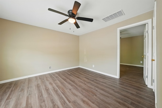 3615 Seabrook St, Houston, TX 77021 - spare room featuring wood finished floors, ceiling fan, and baseboards