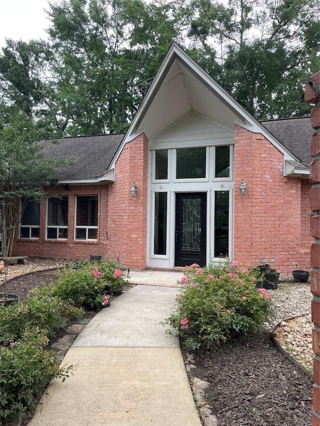 10611 Crystal Cove Dr, Magnolia, TX 77354 - entrance to property featuring a shingled roof and brick siding