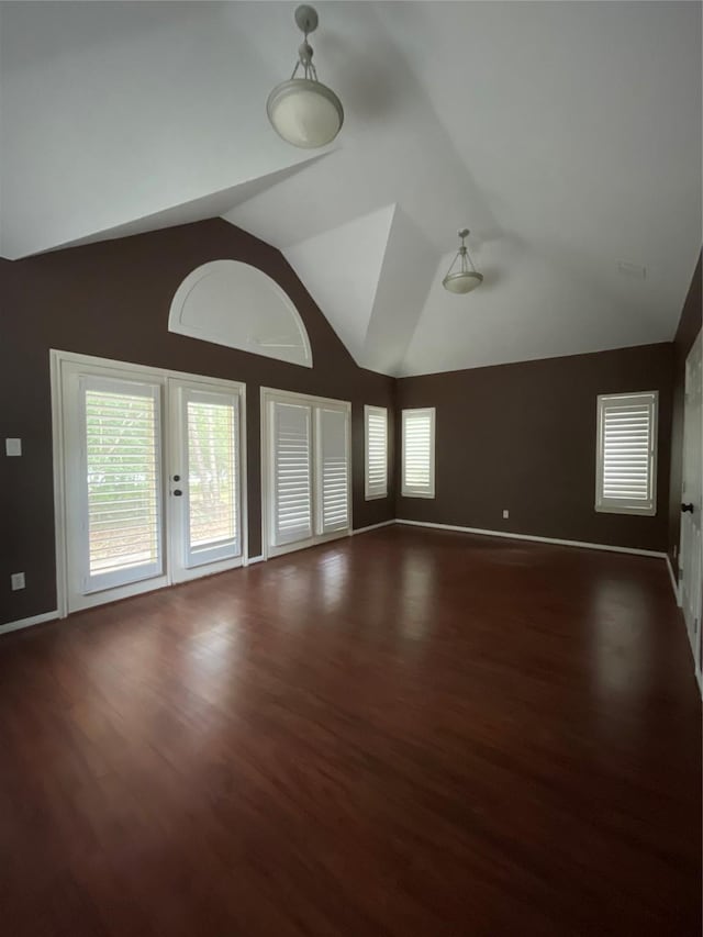10611 Crystal Cove Dr, Magnolia, TX 77354 - unfurnished room featuring wood finished floors, baseboards, and high vaulted ceiling