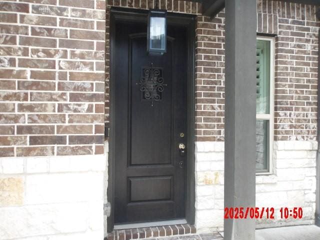 3817 Hawthorn Shadow Ct, Spring, TX 77386 - property entrance with brick siding