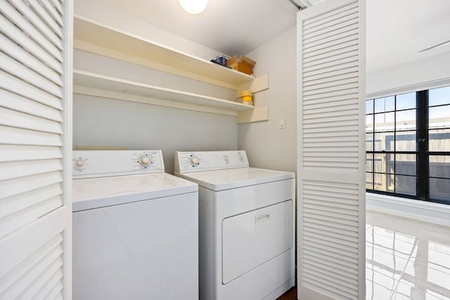 10328 Longmont Dr Unit 47/1, Houston, TX 77042 - clothes washing area with washing machine and clothes dryer