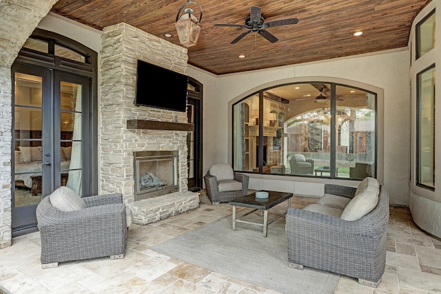 6206 Terwilliger Way, Houston, TX 77057 - view of patio / terrace with french doors, an outdoor stone fireplace, and a ceiling fan