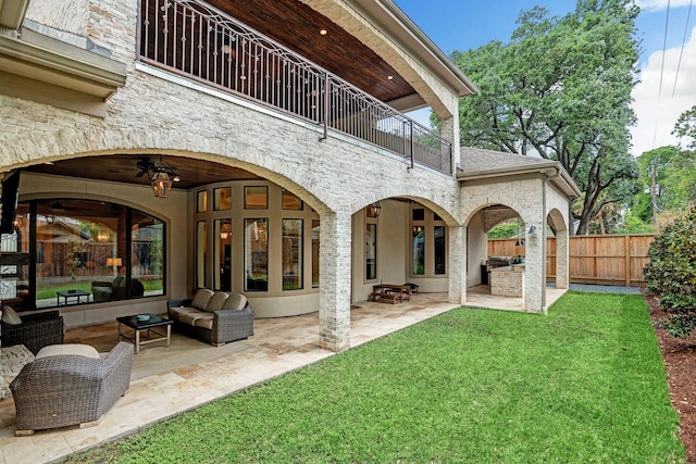 6206 Terwilliger Way, Houston, TX 77057 - rear view of house with a balcony, stone siding, and a patio area
