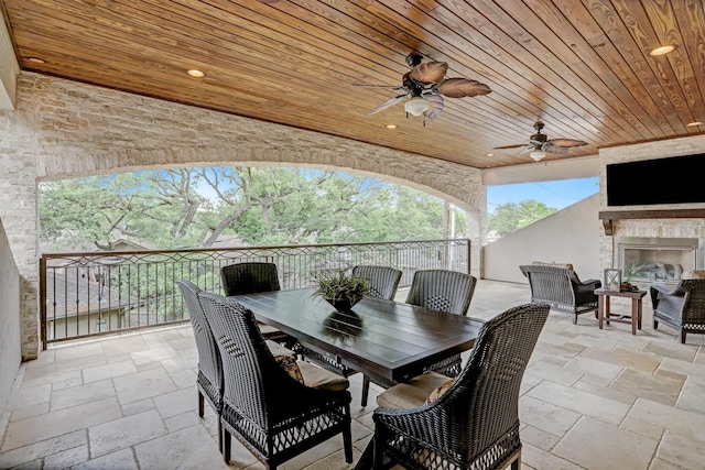 6206 Terwilliger Way, Houston, TX 77057 - view of patio with an outdoor fireplace, a ceiling fan, and outdoor dining space