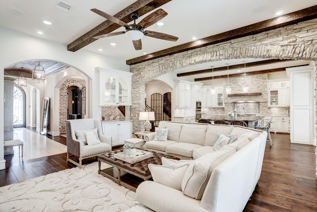 6206 Terwilliger Way, Houston, TX 77057 - living room featuring beam ceiling, arched walkways, a ceiling fan, dark wood-style flooring, and recessed lighting