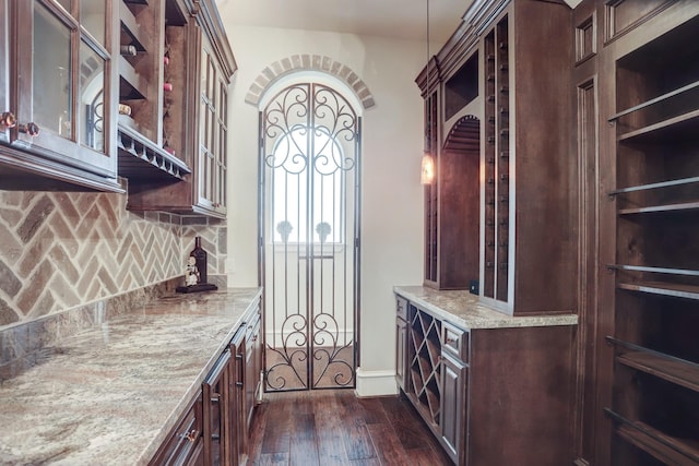 6206 Terwilliger Way, Houston, TX 77057 - bar with dark wood finished floors, decorative backsplash, and baseboards