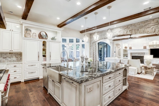 6206 Terwilliger Way, Houston, TX 77057 - kitchen featuring a sink, arched walkways, beamed ceiling, dark wood finished floors, and open shelves