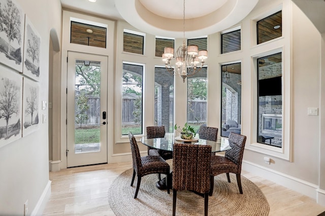 6206 Terwilliger Way, Houston, TX 77057 - dining room with a chandelier, light wood-style floors, baseboards, and a high ceiling