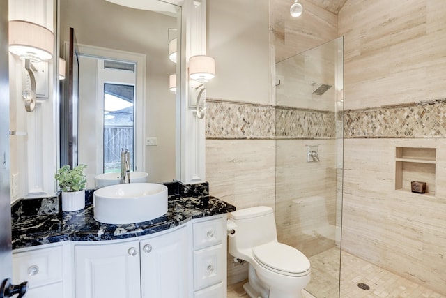 6206 Terwilliger Way, Houston, TX 77057 - bathroom featuring a walk in shower, vanity, toilet, and tile walls