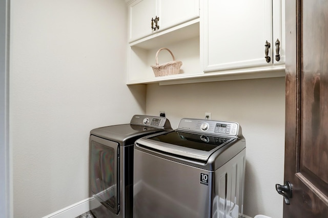 6206 Terwilliger Way, Houston, TX 77057 - laundry room with washer and dryer, cabinet space, and baseboards