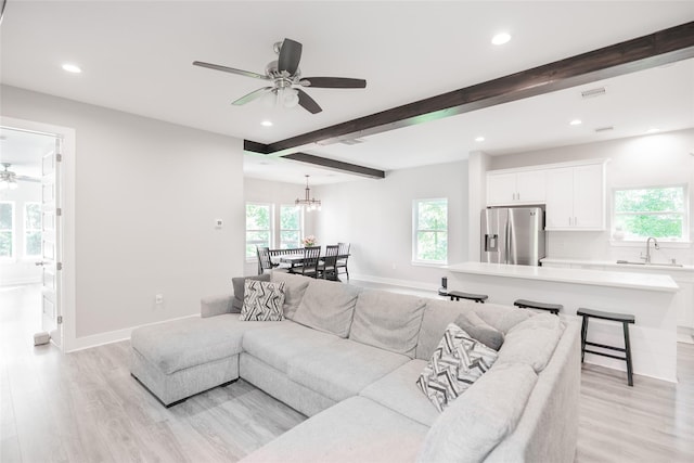 12422 Texas Army Trl, Cypress, TX 77429 - living area with ceiling fan, recessed lighting, light wood-style floors, beamed ceiling, and healthy amount of natural light