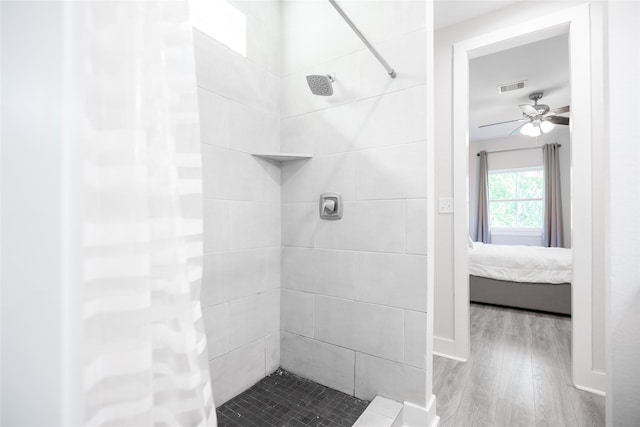 12422 Texas Army Trl, Cypress, TX 77429 - ensuite bathroom featuring wood finished floors, a tile shower, and ceiling fan