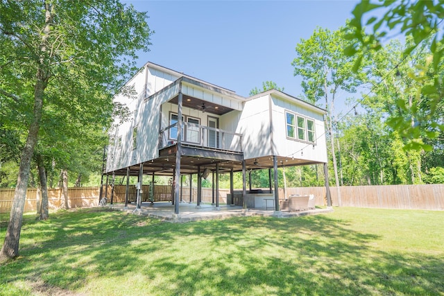 12422 Texas Army Trl, Cypress, TX 77429 - back of property featuring a ceiling fan, a patio area, and a balcony