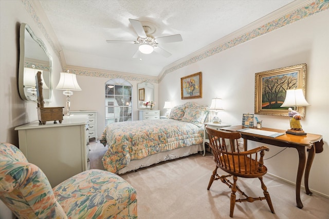 495 N Post Oak Ln, Houston, TX 77024 - bedroom featuring light carpet, ceiling fan, a textured ceiling, and ornamental molding