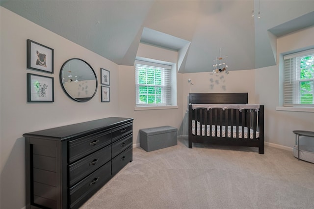 12438 Piping Rock Dr, Houston, TX 77077 - bedroom with vaulted ceiling, light colored carpet, baseboards, and a nursery area