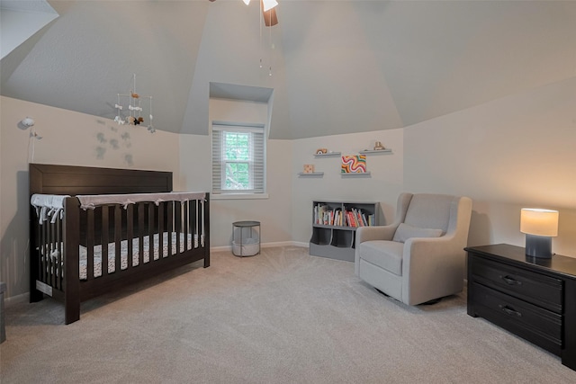12438 Piping Rock Dr, Houston, TX 77077 - carpeted bedroom featuring vaulted ceiling, a nursery area, baseboards, and a ceiling fan