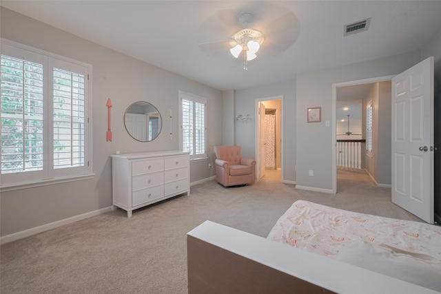 12438 Piping Rock Dr, Houston, TX 77077 - bedroom with multiple windows, light carpet, and baseboards