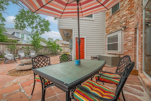 12438 Piping Rock Dr, Houston, TX 77077 - fenced backyard with a patio and outdoor dining space