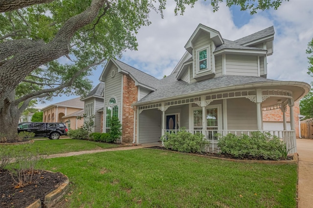 12438 Piping Rock Dr, Houston, TX 77077 - victorian house featuring covered porch, a front yard, and roof with shingles