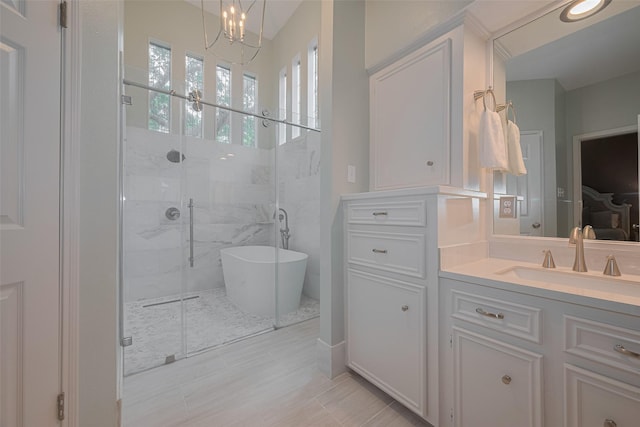 12438 Piping Rock Dr, Houston, TX 77077 - full bath with a shower stall, a freestanding bath, vanity, and a chandelier