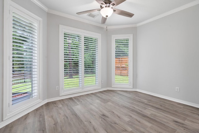 25818 Overlake Dr, Spring, TX 77380 - unfurnished room with ornamental molding, wood finished floors, healthy amount of natural light, and a ceiling fan