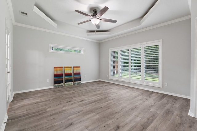 25818 Overlake Dr, Spring, TX 77380 - spare room with ceiling fan, a raised ceiling, wood finished floors, and ornamental molding