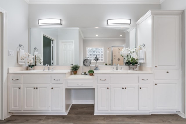 25818 Overlake Dr, Spring, TX 77380 - full bathroom with ornamental molding, double vanity, a stall shower, wood finished floors, and recessed lighting