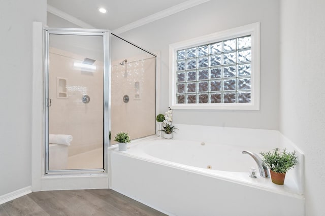25818 Overlake Dr, Spring, TX 77380 - bathroom featuring a bath, a shower stall, wood finished floors, and ornamental molding