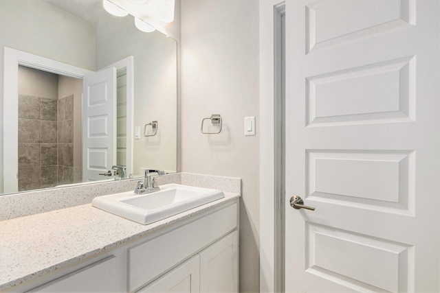 28622 Mountain Timber Ct, Fulshear, TX 77441 - bathroom featuring vanity and a tile shower