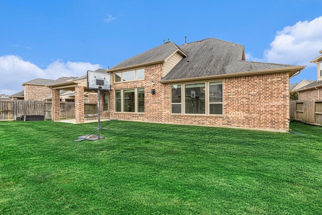 28622 Mountain Timber Ct, Fulshear, TX 77441 - back of property with brick siding, a shingled roof, and a patio area