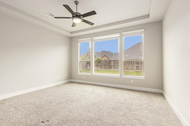 28622 Mountain Timber Ct, Fulshear, TX 77441 - unfurnished room featuring a tray ceiling, carpet, and baseboards