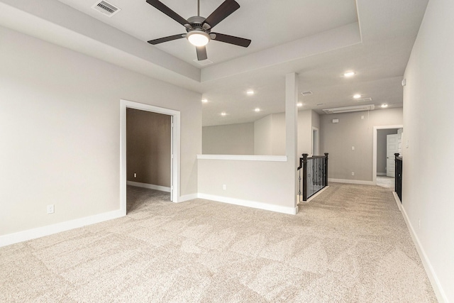 28622 Mountain Timber Ct, Fulshear, TX 77441 - unfurnished living room with light carpet, recessed lighting, ceiling fan, baseboards, and attic access