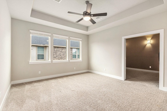 28622 Mountain Timber Ct, Fulshear, TX 77441 - carpeted empty room with a tray ceiling, ceiling fan, and baseboards