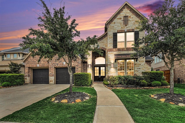 28622 Mountain Timber Ct, Fulshear, TX 77441 - view of front of home featuring french doors, stone siding, driveway, and a front yard
