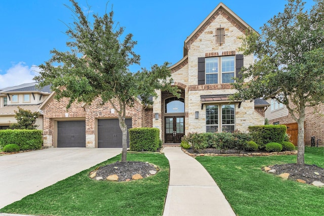 28622 Mountain Timber Ct, Fulshear, TX 77441 - view of front of home featuring french doors, stone siding, concrete driveway, and brick siding