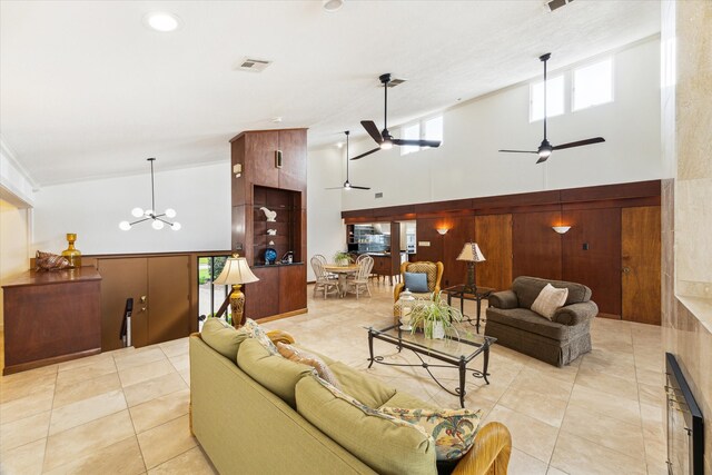 2414 Baycrest Dr, Houston, TX 77058 - living room with a towering ceiling, a ceiling fan, light tile patterned floors, and a chandelier