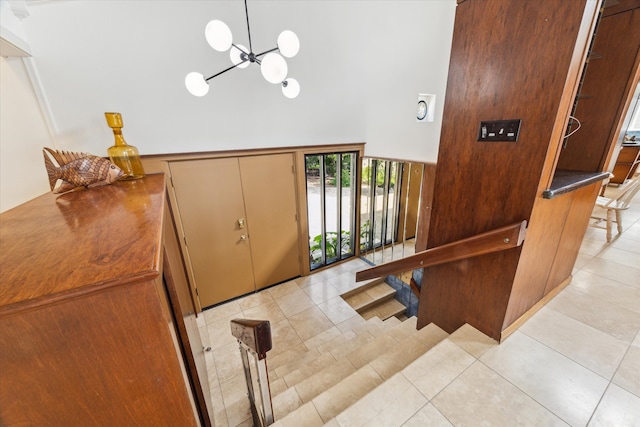 2414 Baycrest Dr, Houston, TX 77058 - entrance foyer featuring a towering ceiling, a chandelier, and light tile patterned flooring