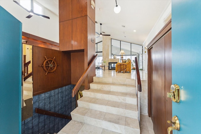 2414 Baycrest Dr, Houston, TX 77058 - stairway featuring ceiling fan and tile patterned floors