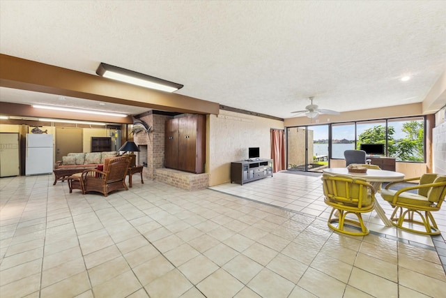 2414 Baycrest Dr, Houston, TX 77058 - living area featuring light tile patterned flooring, a textured ceiling, and ceiling fan