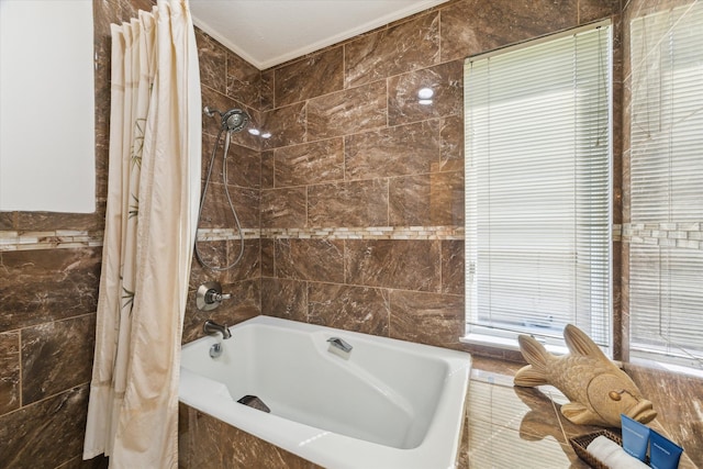2414 Baycrest Dr, Houston, TX 77058 - bathroom with tile walls and shower / tub combo