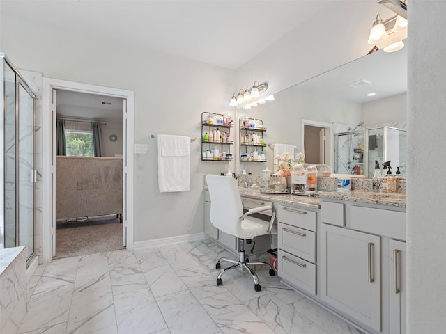 2815 Skerne Forest Dr, Spring, TX 77373 - bathroom featuring a shower stall, vanity, marble finish floors, and baseboards