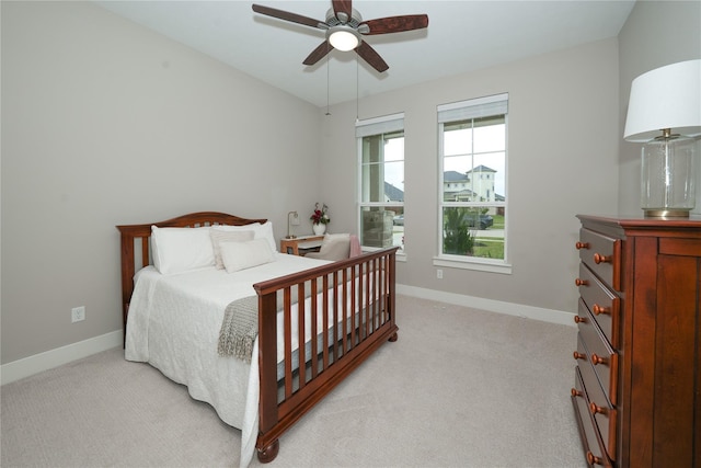 413 Stratus View Ct, Katy, TX 77493 - bedroom with light colored carpet, baseboards, and a ceiling fan