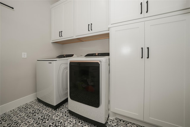 413 Stratus View Ct, Katy, TX 77493 - washroom with cabinet space, washer and clothes dryer, and baseboards