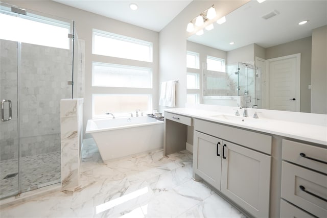 413 Stratus View Ct, Katy, TX 77493 - full bathroom with a shower stall, a freestanding bath, marble tiled flooring, vanity, and recessed lighting