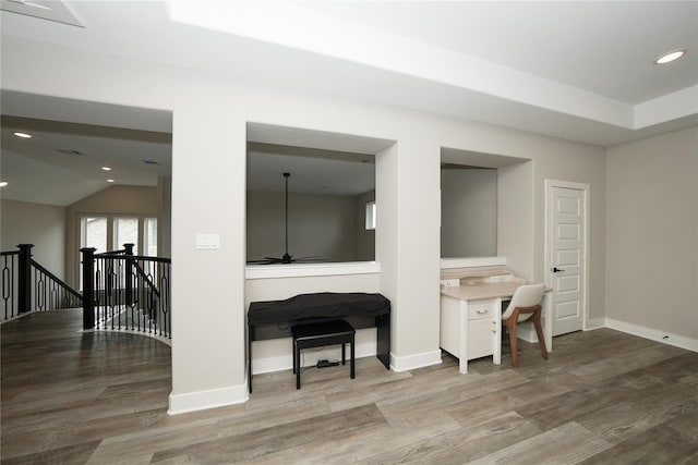 413 Stratus View Ct, Katy, TX 77493 - living room featuring wood finished floors, baseboards, recessed lighting, lofted ceiling, and a desk