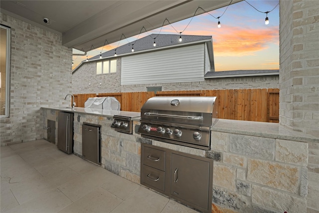 413 Stratus View Ct, Katy, TX 77493 - patio terrace at dusk featuring area for grilling and fence